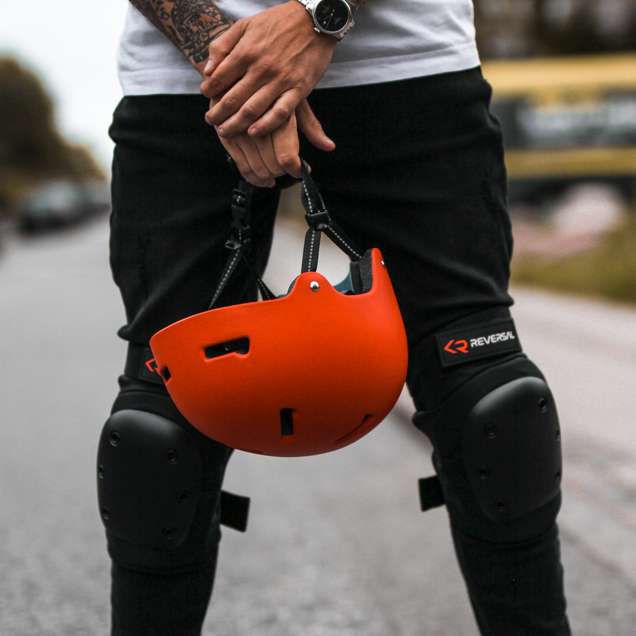 Reversal protection action sport helmet and knee pads